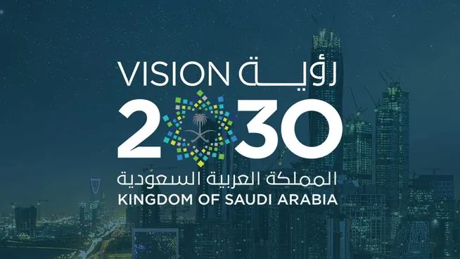 The Saudi Vision 2030 lockup over the Riyadh skyline at night